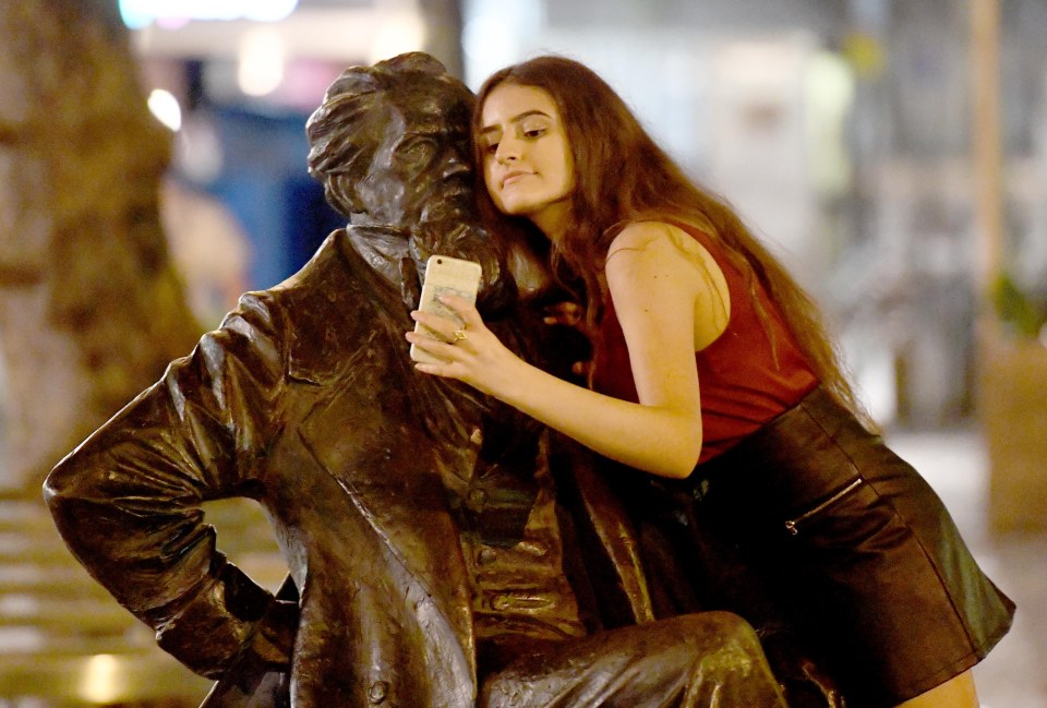  Selfies with a statue: This party goer seems more interested in getting a good snap than heading to the nearest bar in Portsmouth