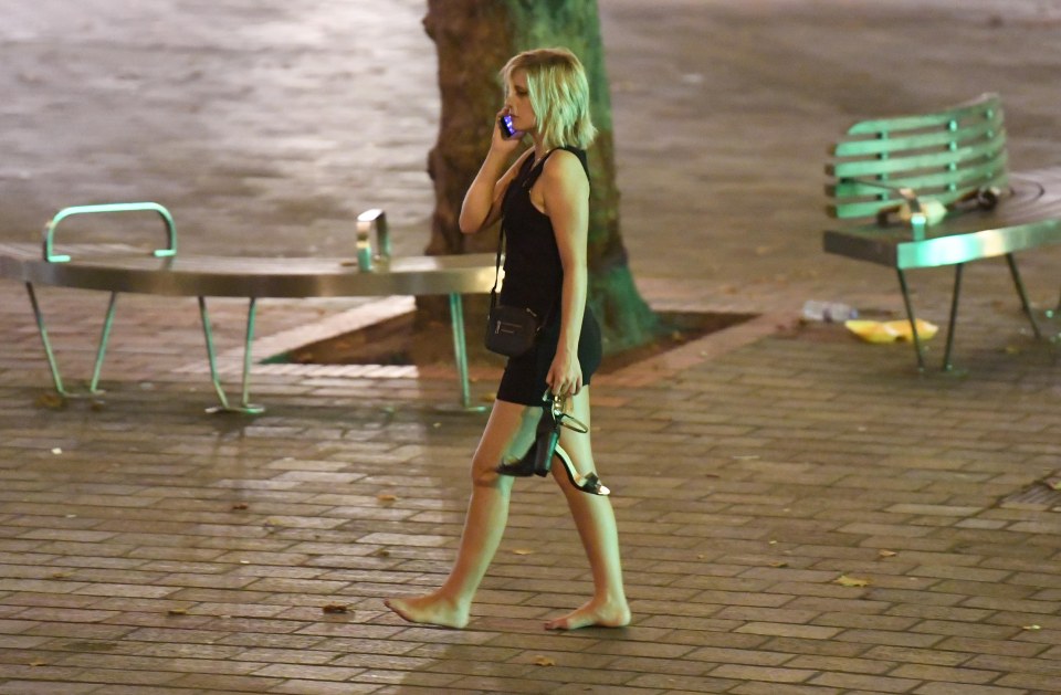  This fresher seems to have given up on wearing shoes for the night as she phones a friend after a night in Portsmouth