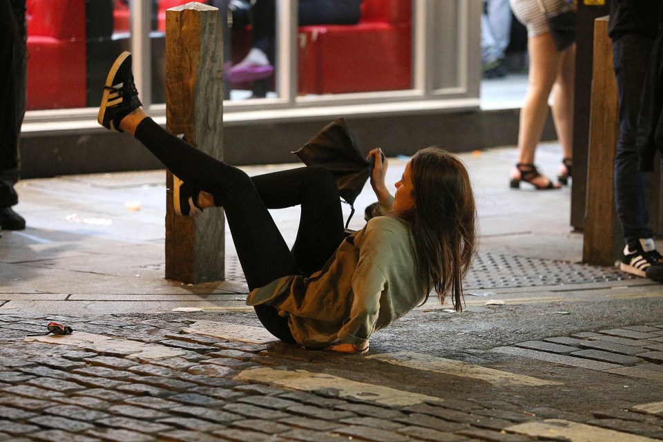  Some struggle to keep their balance as they make their way through town centre in Liverpool