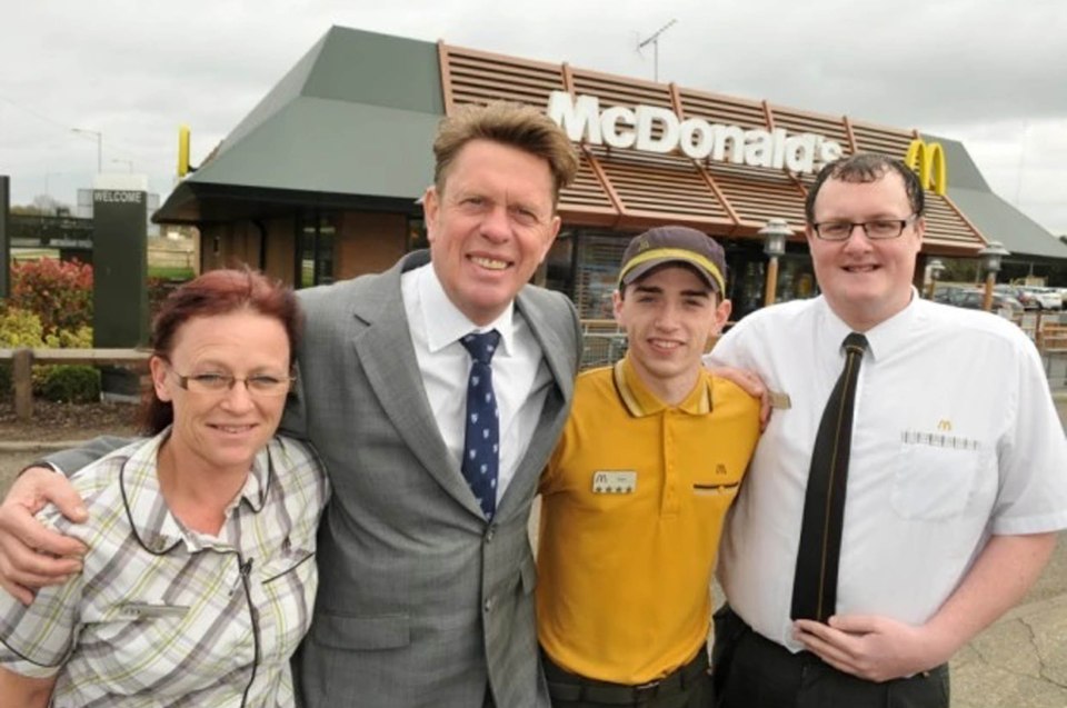  Mr Cuthbert, pictured here with staff, has been slammed for not accepting Scottish money in his 10 stores