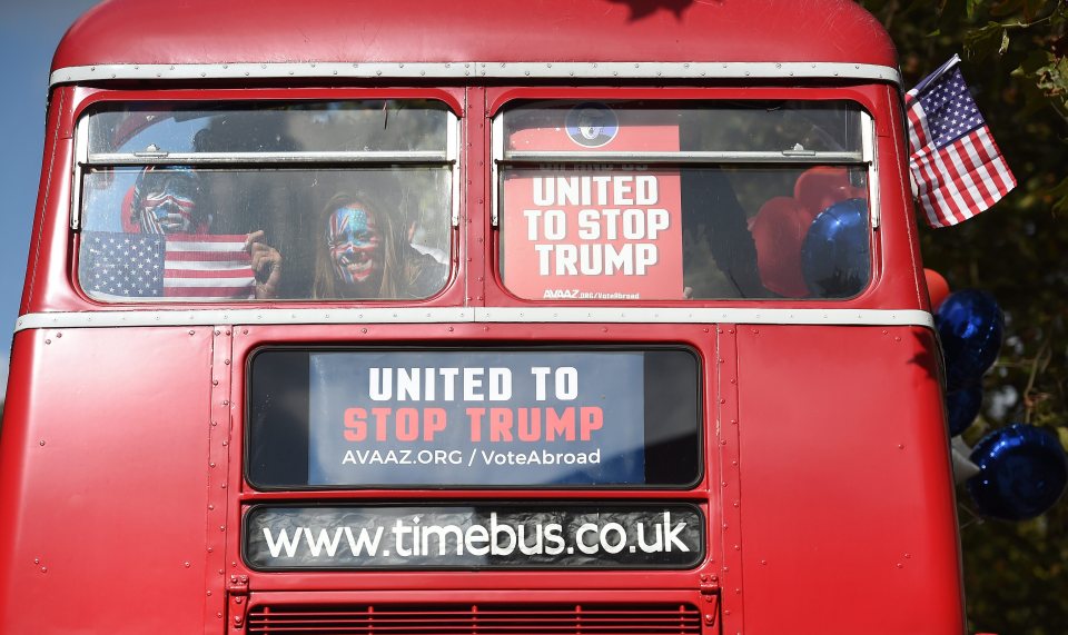  Avaaz has lots of red, white and blue balloons on their bus as well as a lot of American flags