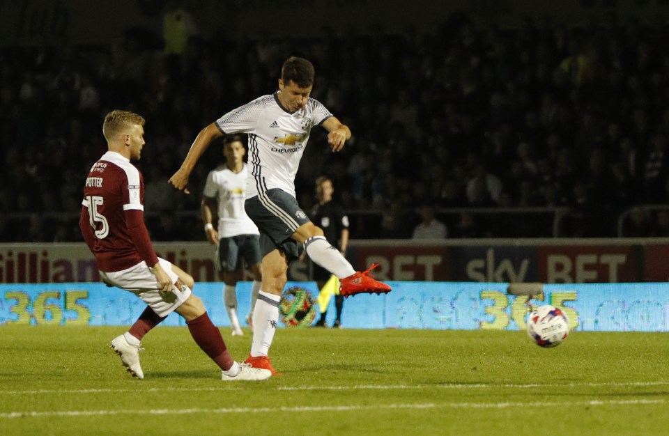 Ander Herrera drives his low shot in to put Manchester United 2-1 up against Northampton