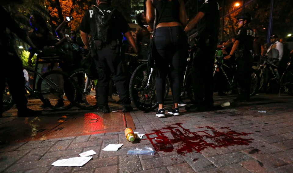  Blood covers the pavement where a person was shot in uptown Charlotte