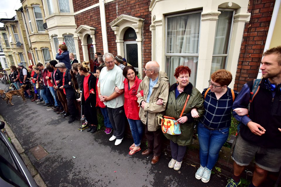  Around 30 people linked arms and stood side by side to build a wall of bodies stopping bailiffs from getting inside