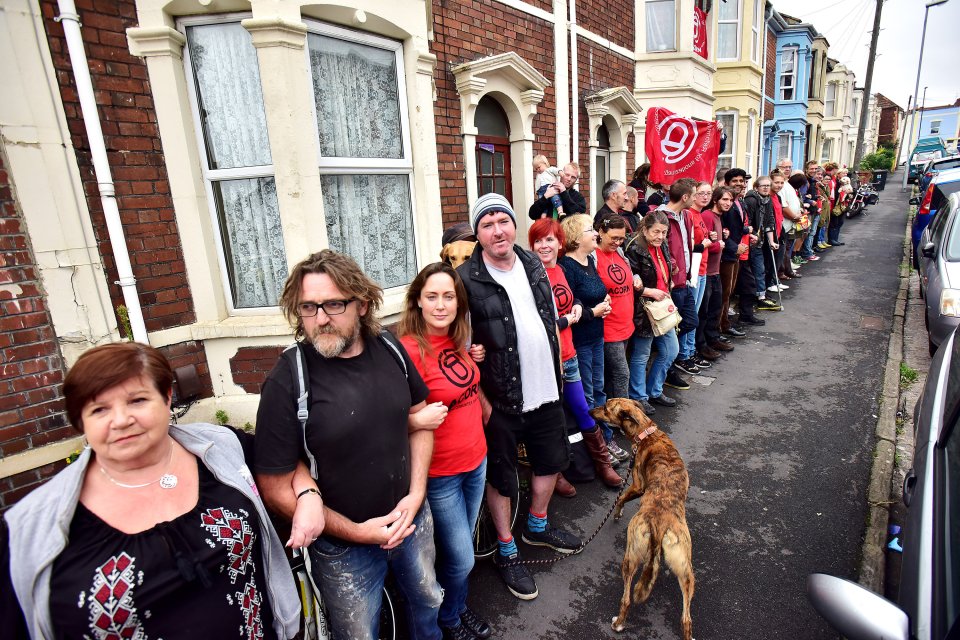  Kind-hearted neighbours in Bristol formed a human chain around a mum's house - to stop her being kicked out in a 'revenge eviction'