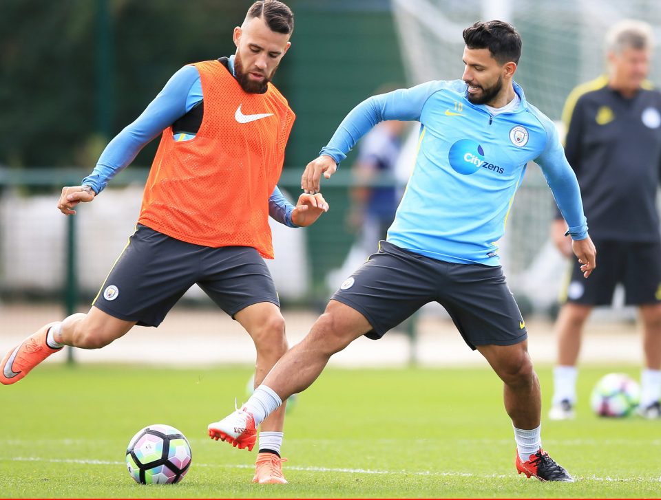  Aguero and Nicholas Otamendi get stuck in