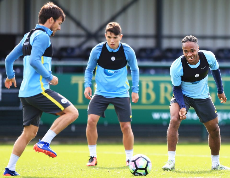  Raheem Sterling prepares to challenge David Silva