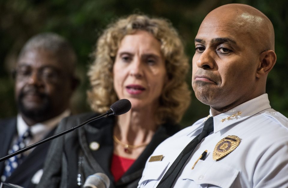 Police Chief Kerr Putney, right, and Charlotte Mayor Jennifer Roberts field questions from the media