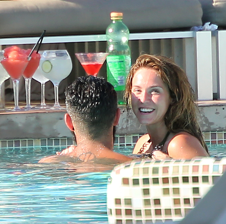  Vicky is all smiles at the swim-up bar