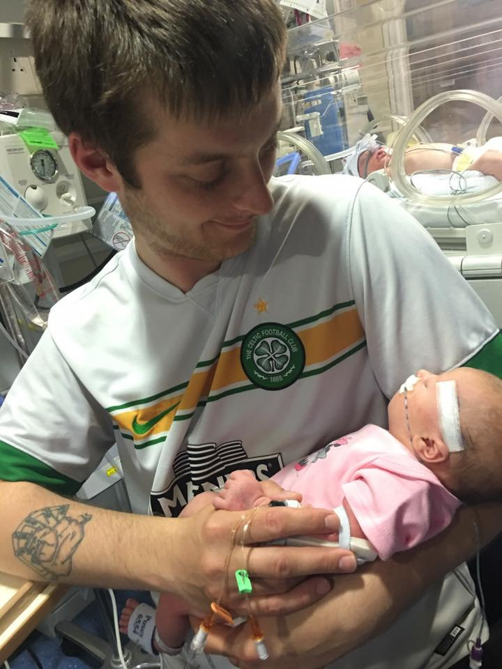 Dad, George McPhee, with his daughter in the hospital following the operation