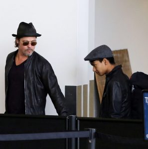  We told how Brad, picture here with son Maddox at an airport last June, got into a fight with the 15-year-old on a private jet