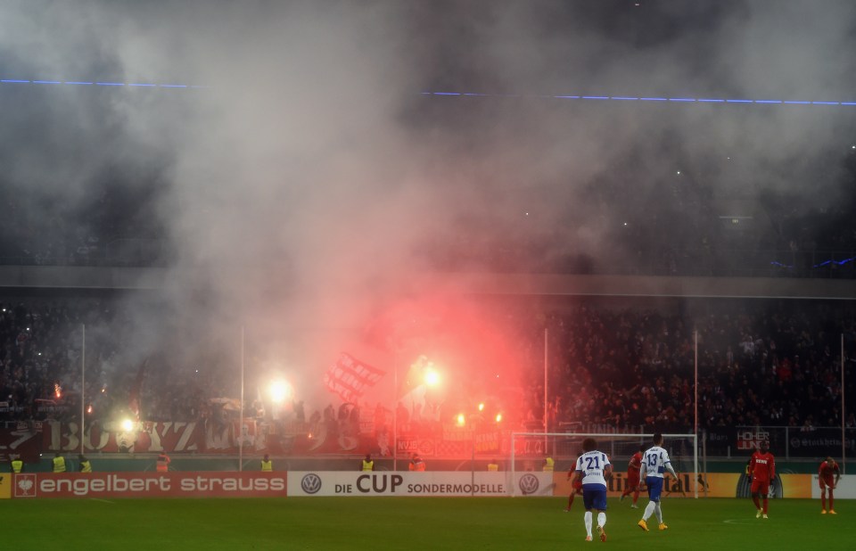  The fan threw the flare from the upper tier of Cologne's home ground