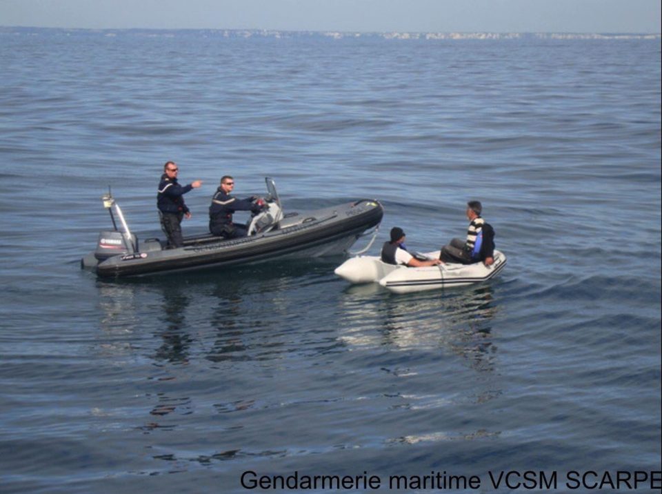  French coastguards rescued two migrants who were trying to cross the Channel in a children's dinghy