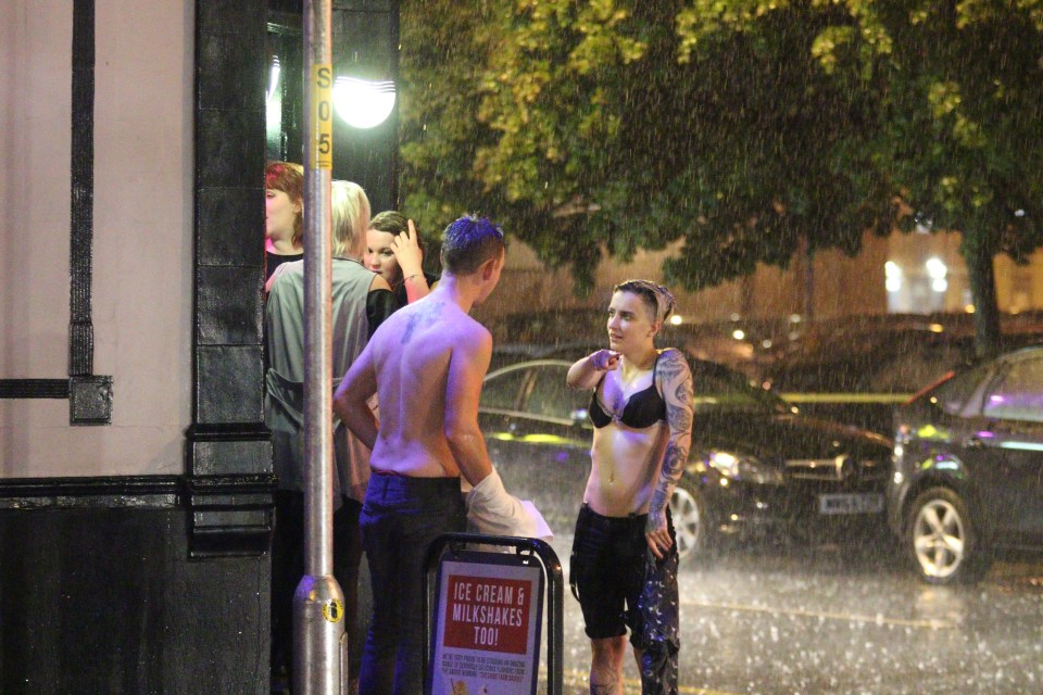  Some students were seen running topless in the rain amid boozy scenes in Manchester last night