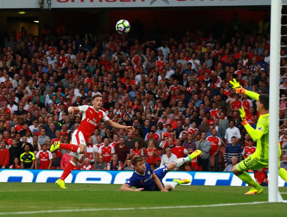 Mesut Ozil scores against Chelsea on Saturday as the Gunners cruised to a 3-0 victory 