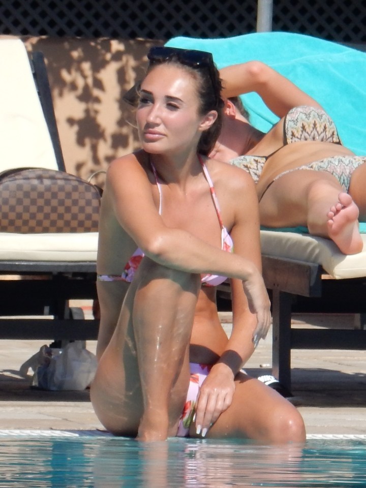  Megan looked stunning in a rose-patterned bikini