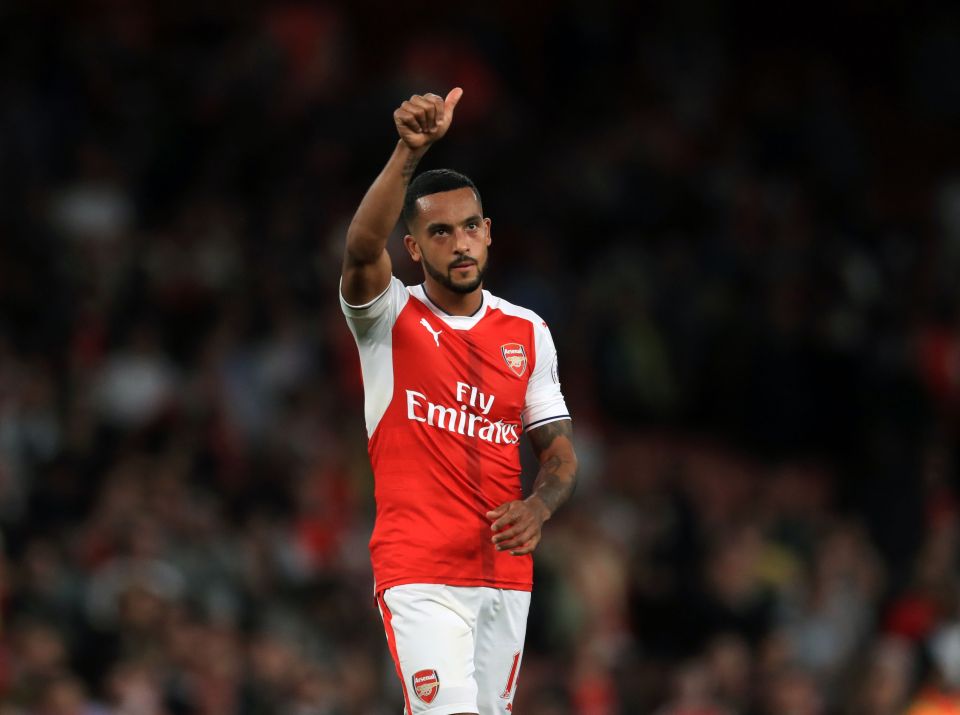  Theo Walcott celebrates after scoring ion the 3-0 win over Chelsea