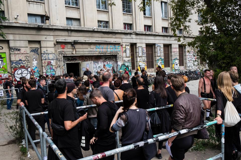 Clubbers queue for hours outside of the Berghain nightclub on a Sunday afternoon