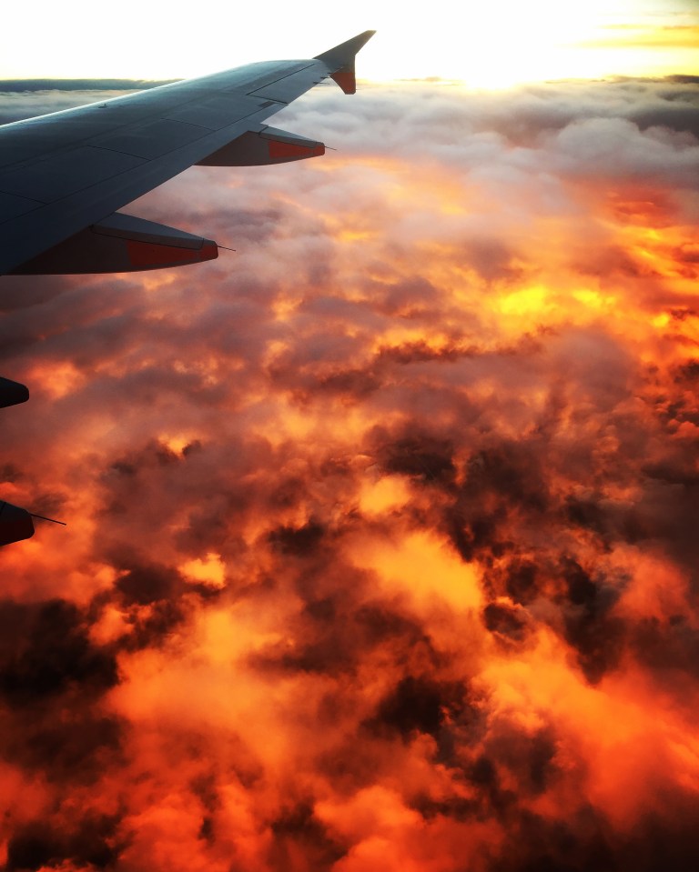  This stunning photo taken from a plane window appears to show the sky on fire