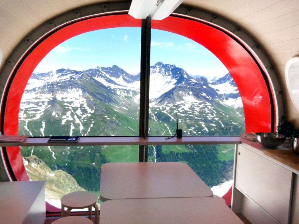 The stunning view from the window of the Bivouac Gervasutti in the Italian Alps. The hotel is built high into the Grandes and Petites Jorasses mountains at 2,835 metres above sea level in Italy