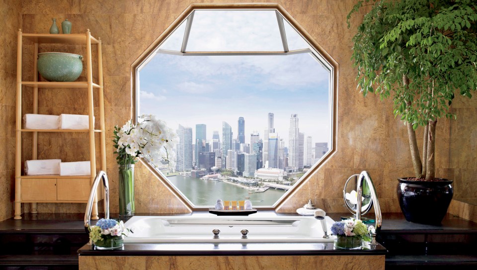 The Ritz-Carlton Suite at the Ritz-Carlton in Singapore enjoy views of the Singapore skyline and the vibrant Marina Bay