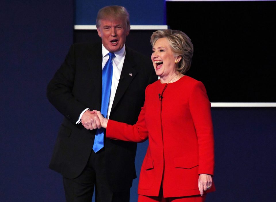 Hillary Clinton shakes hands with Donald Trump 