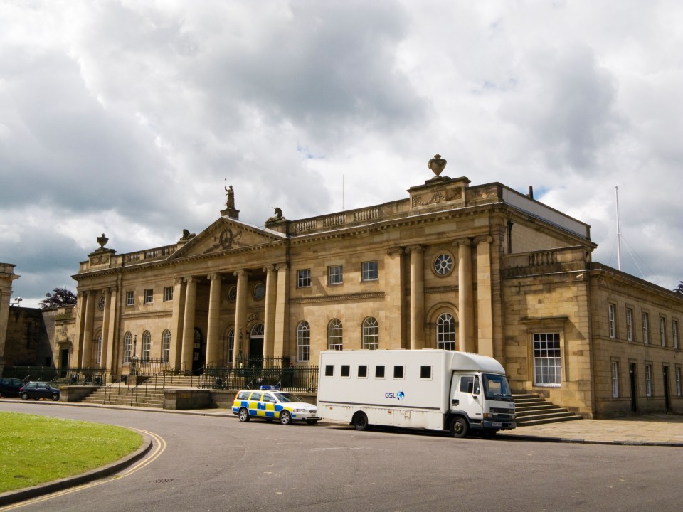 Police car and Prison van parked outside York Crown Court at York England UK