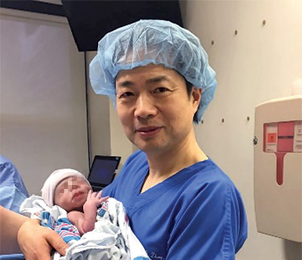  The world's first baby, born using the controversial three-parent technique, has been born in Mexico. Pictured. Dr John Zhang who led the treatment is pictured with the baby boy