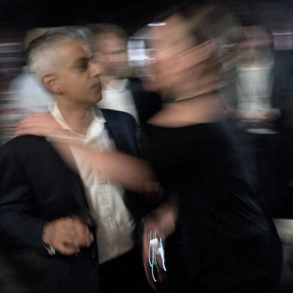  Sadiq Khan looks like he is desperate to escape as the woman goes to put her arm on his shoulder after trying to kiss him