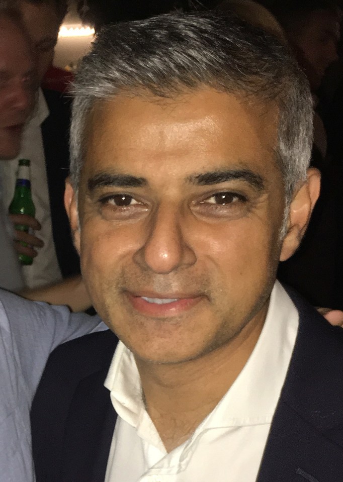  Mayor of London Sadiq Khan pictured looking much happier after managing to get away from the selfie and kiss hunter