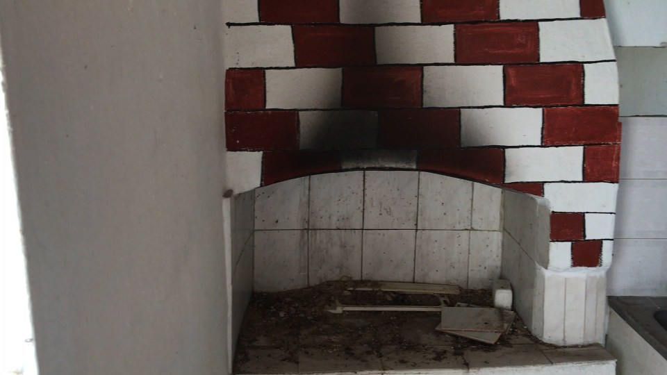  The abandoned fireplace still shows signs of use, but has not been used for 15 years