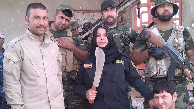  The machete-wielding housewife leads a band of around 70 militia in her Iraqi hometown