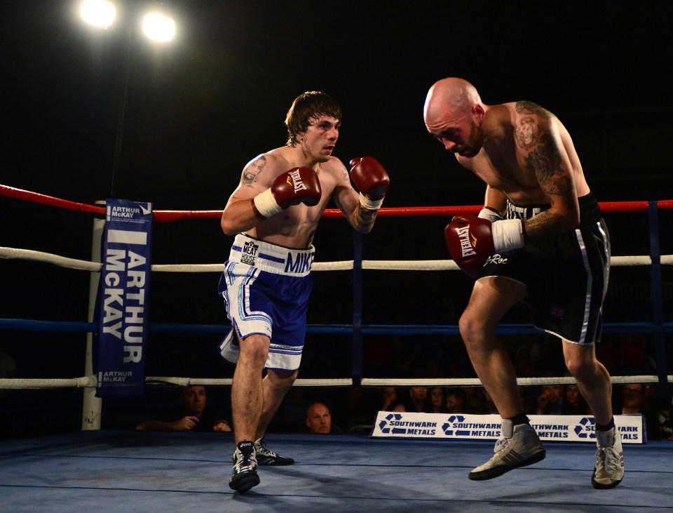  Towell (blue shorts) in action against Danny Little