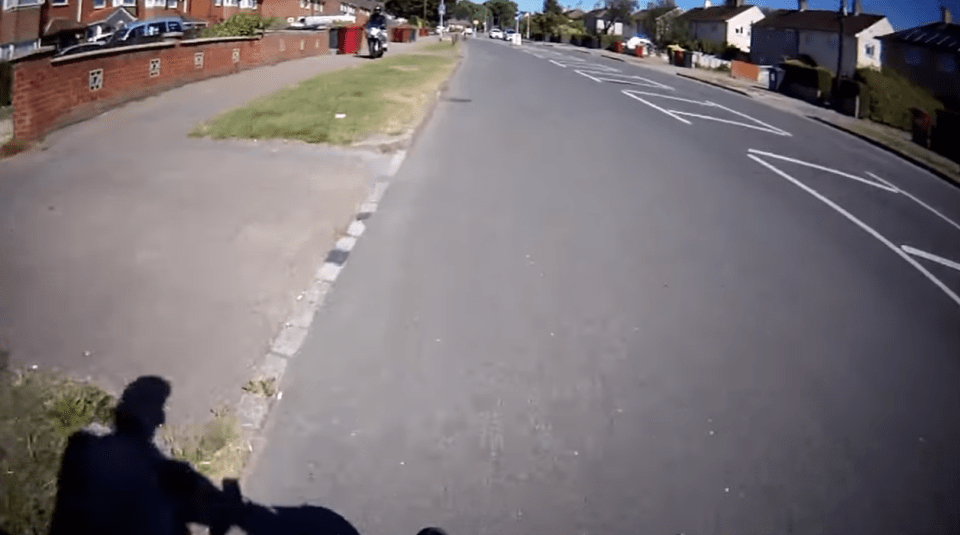  The motorbike rider doubles back to the cyclist to argue over road rules