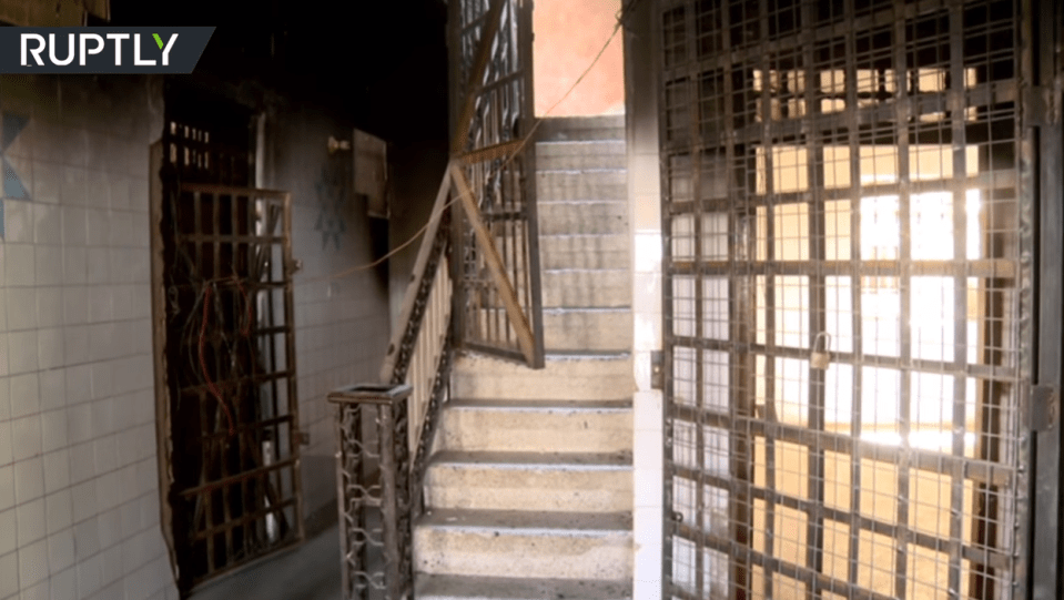  The group of cages are apparently in the waiting area, so many different and terrified people would be caged together near the court where they could be sentenced to death