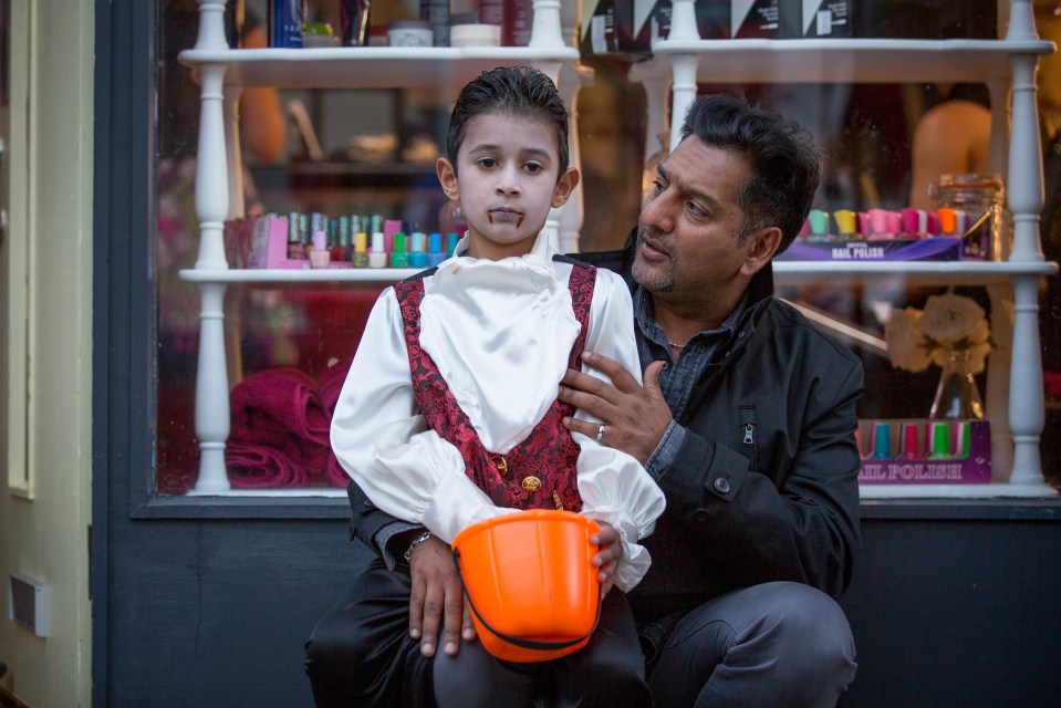  EastEnders: Kamil and Masood wait outside Elysium as the trick or treating gets underway