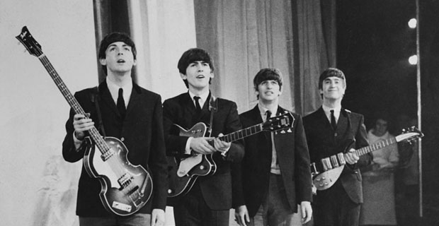  The Beatles take a bow on stage after starring at the Royal Command Performance in London in 1963.