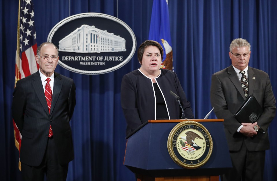 Assistant Attorney General Leslie R. Caldwell, center, of the Criminal Division; Kenneth Magidson, left, of the Southern District of Texas; and Bruce M. Foucart, director, National Intellectual Property Rights Coordination Center, participate in a news conference at the Justice Department in Washington, Thursday, Oct. 27, 2016. Justice Department is announcing charges in connection with a call center operation said to be based in India. Federal prosecutors have unsealed an indictment charging 61 defendants in the United States and abroad, including five call center groups. The department says the extorted funds ended up being laundered with the help of prepaid debit cards. Arrests are taking place throughout the United States. (AP Photo/Pablo Martinez Monsivais)