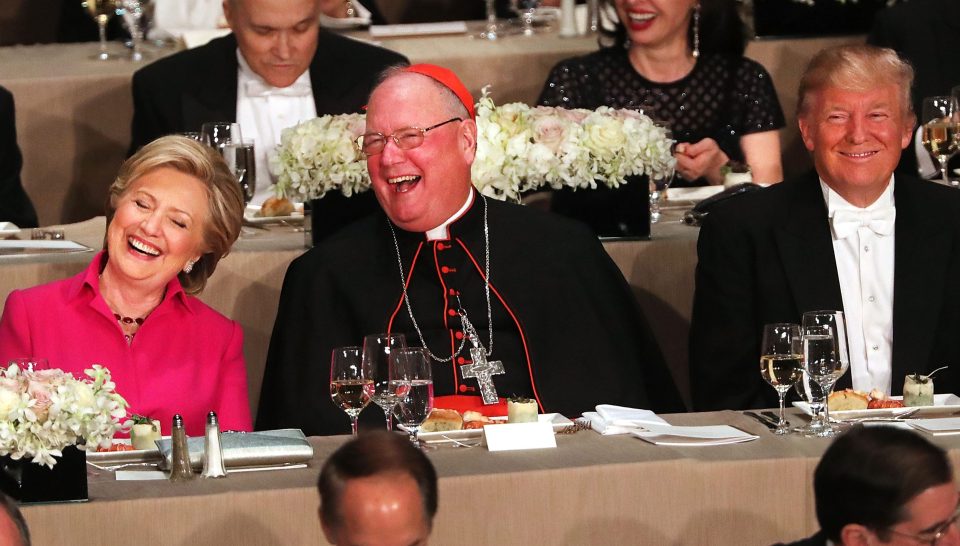  Cardinal Timothy Dolan kept the peace by staying between the pair while they ate