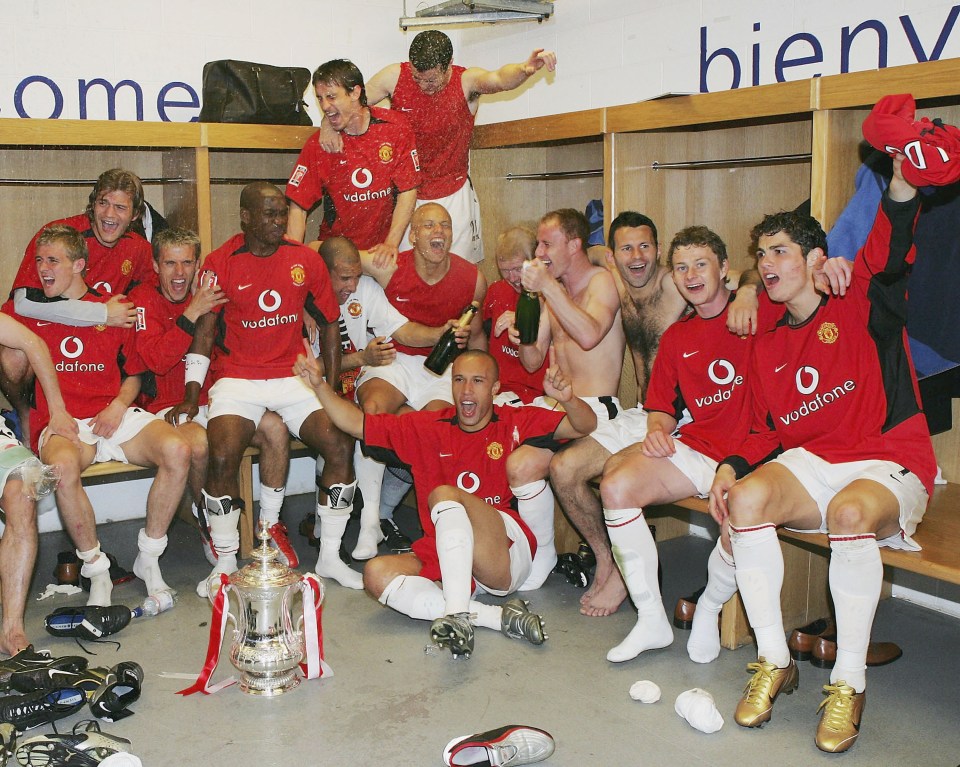 CARDIFF, WALES - MAY 22: Darren Fletcher, Roy Carroll, Phil Neville, Eric Djemba-Djemba, Tim Howard, Gary Neville, John O'Shea, Wes Brown, Mikael Silvestre, Nicky Butt, Ryan Giggs, Ole Gunnar Solskjaer and Cristiano Ronaldo of Manchester United celebrate with the FA Cup after winning the AXA FA Cup Final between Manchester United and Millwall at the Millennium Stadium on May 22, 2004 in Cardiff, Wales. (Photo by Matthew Peters/Manchester United via Getty Images)