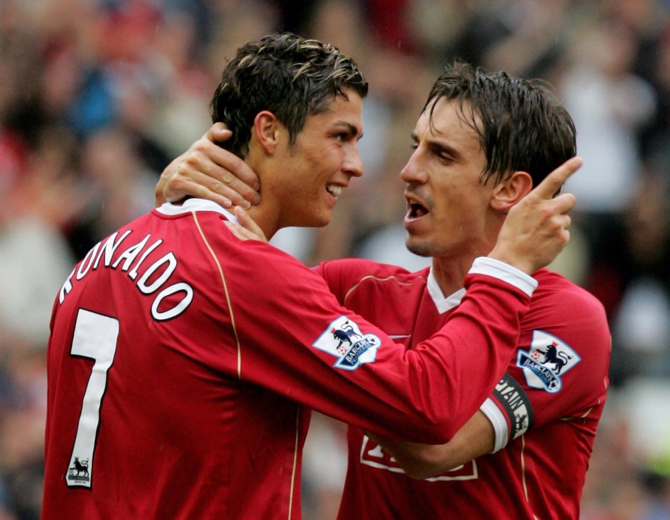 MANCHESTER, ENGLAND - OCTOBER 1: Cristiano Ronaldo of Manchester United celebrates Ole Gunnar Solskjaer scoring the first goal with team mate Gary Neville during the Barclays Premiership match between Manchester United and Newcastle United at Old Trafford on October 1 2006 in Manchester, England. (Photo by Matthew Peters/Manchester United via Getty Images)