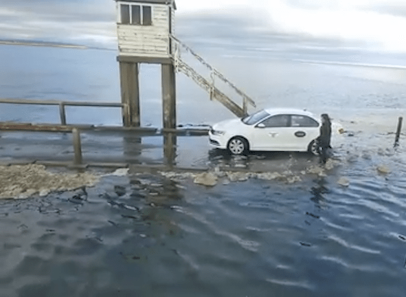 Eventually the taxi makes it to a high point on the road, where he gets stranded