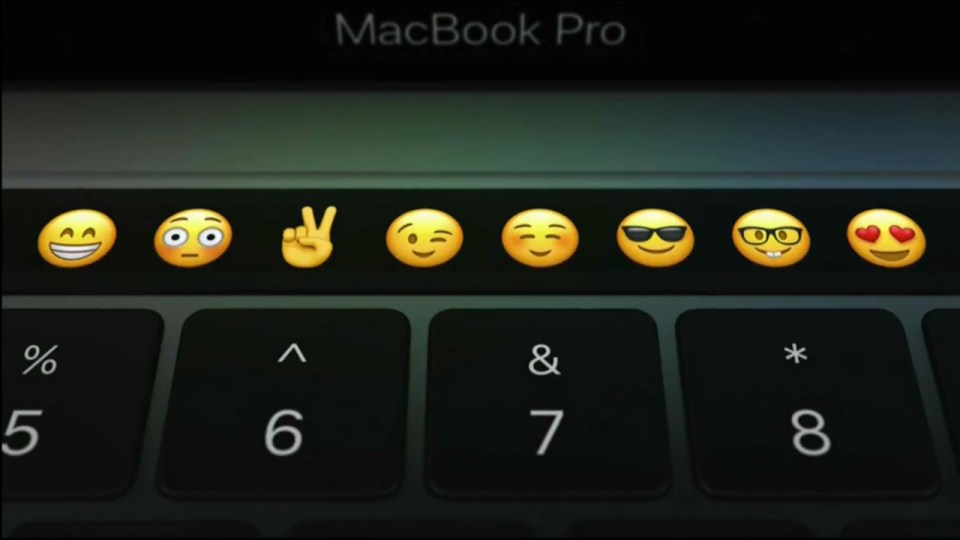  The laptop's Touch Bar can be used to easily select a range of emojis