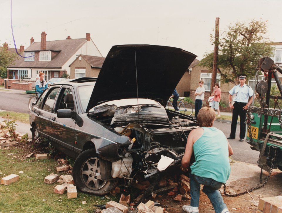 Tony Adams' Ford Sierra is removed from the scene of his accident in Rayleigh, Essex.