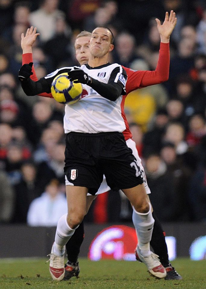 Bobby Zamora fends off United defender Ritchie De Laet on a December day when the Fulham striker boosted his England hopes with his 10th goal of the 2009-10 season