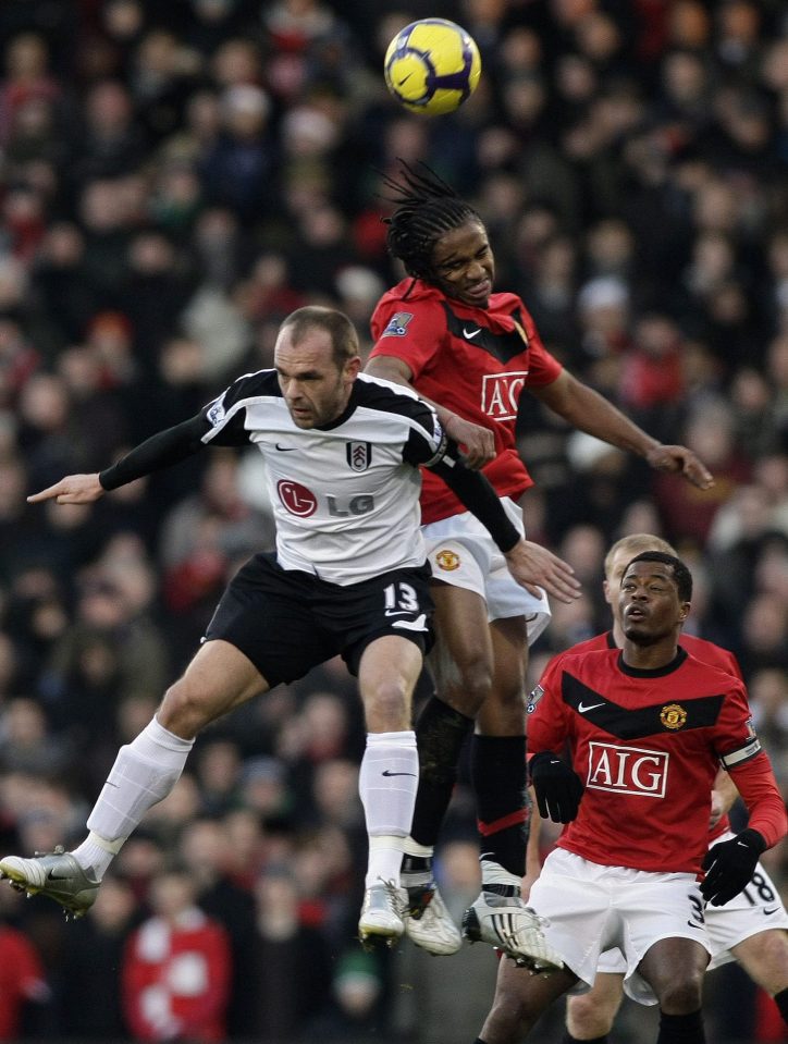 United fringe player Anderson and Fulham midfielder Danny Murphy tussle in a shock 3-0 win for the Londoners