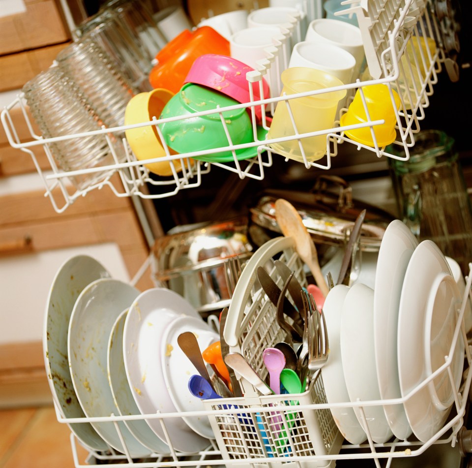 dishwasher full of dirty plates