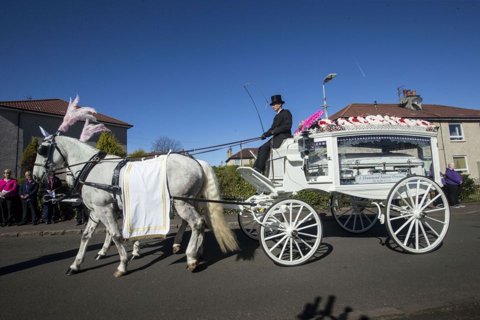  Paige's coffin is transported by horse-drawn carriage following her funeral at St Margaret's Church in Clydebank