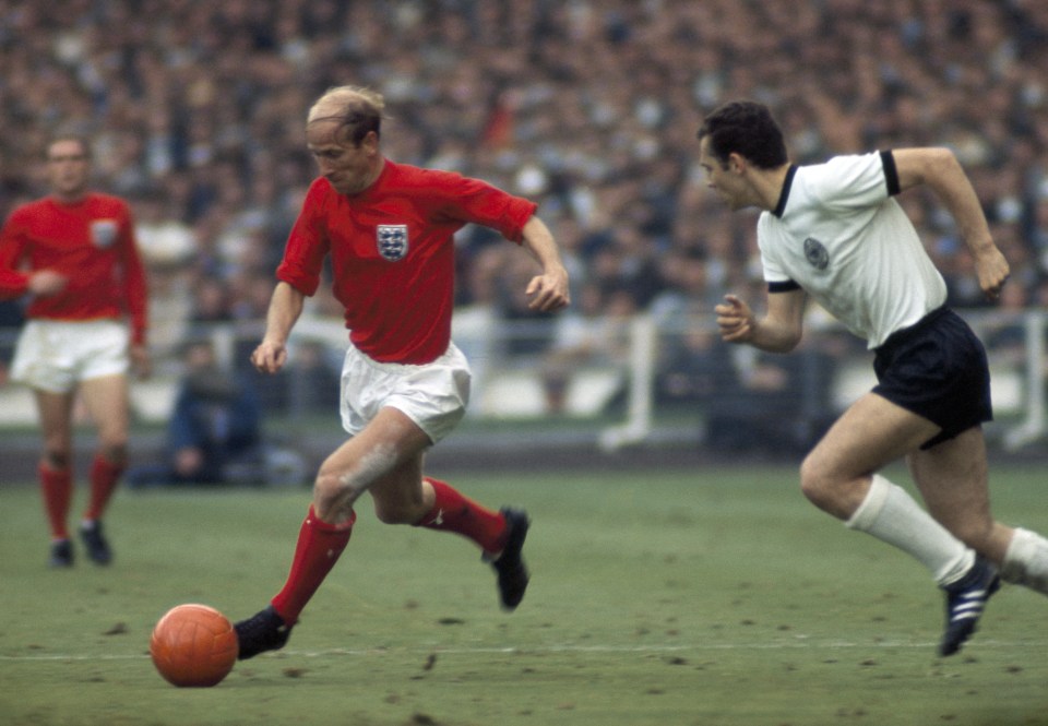 A photo to treasure, Bobby Charlton is caught on camera trying to escape the attentions of fellow great Franz Beckenbauer of West Germany