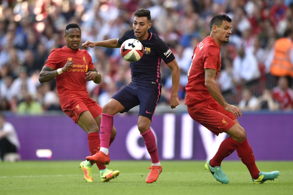 Clyne (left) in action against Barca in a pre-season friendly